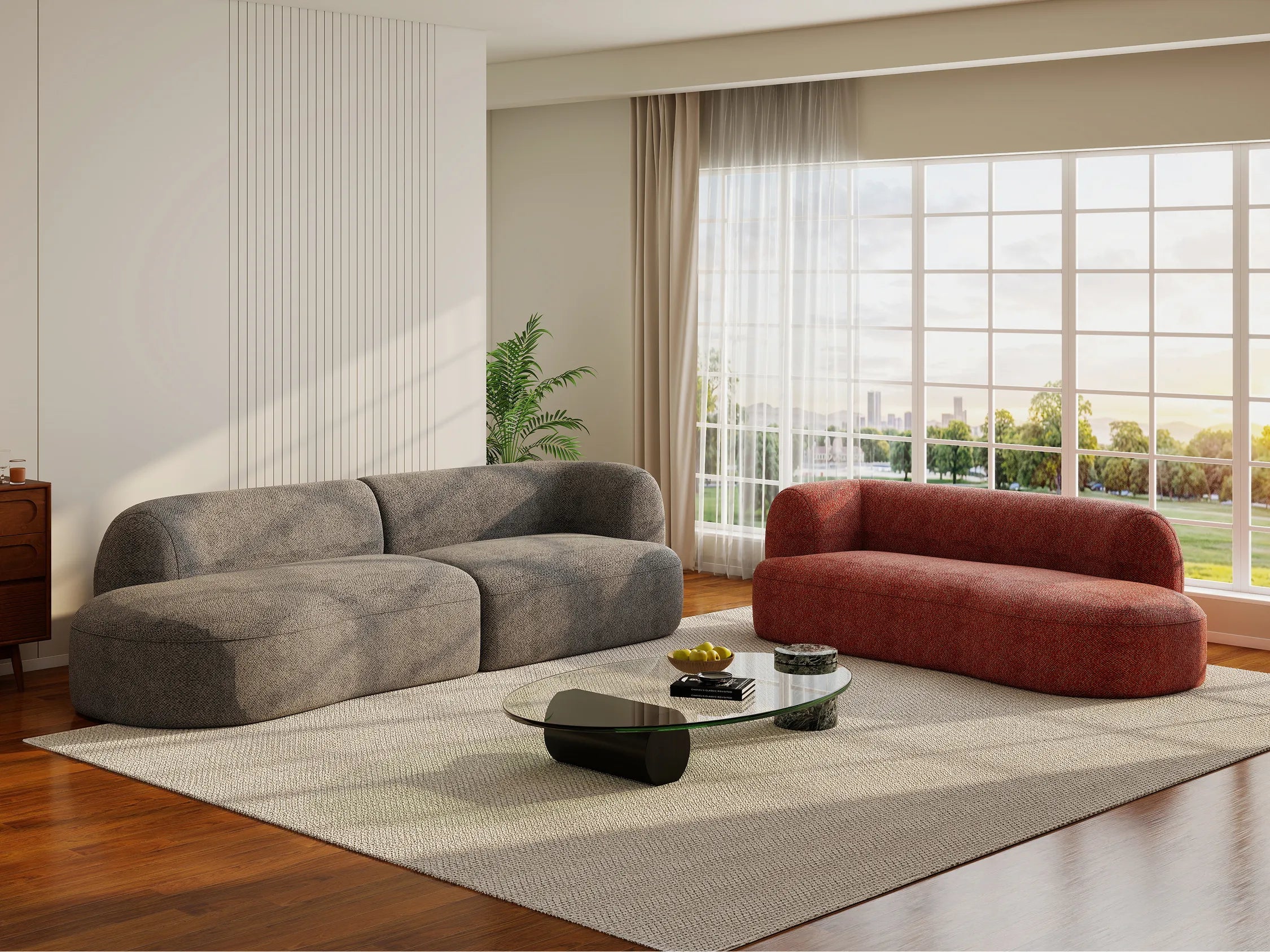 Arc Modular Sofa in Basalt Dark Grey and Clay Red arranged as separate lounge pieces in a living room